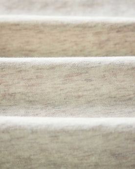 material shot of the logo on The Cotton Hemp Polo in Heather Oat, Knits by Taylor Stitch