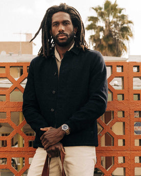 fit model leaning against the wall wearing The Crew Jacket in Raw Indigo Sashiko, Outerwear by Taylor Stitch
