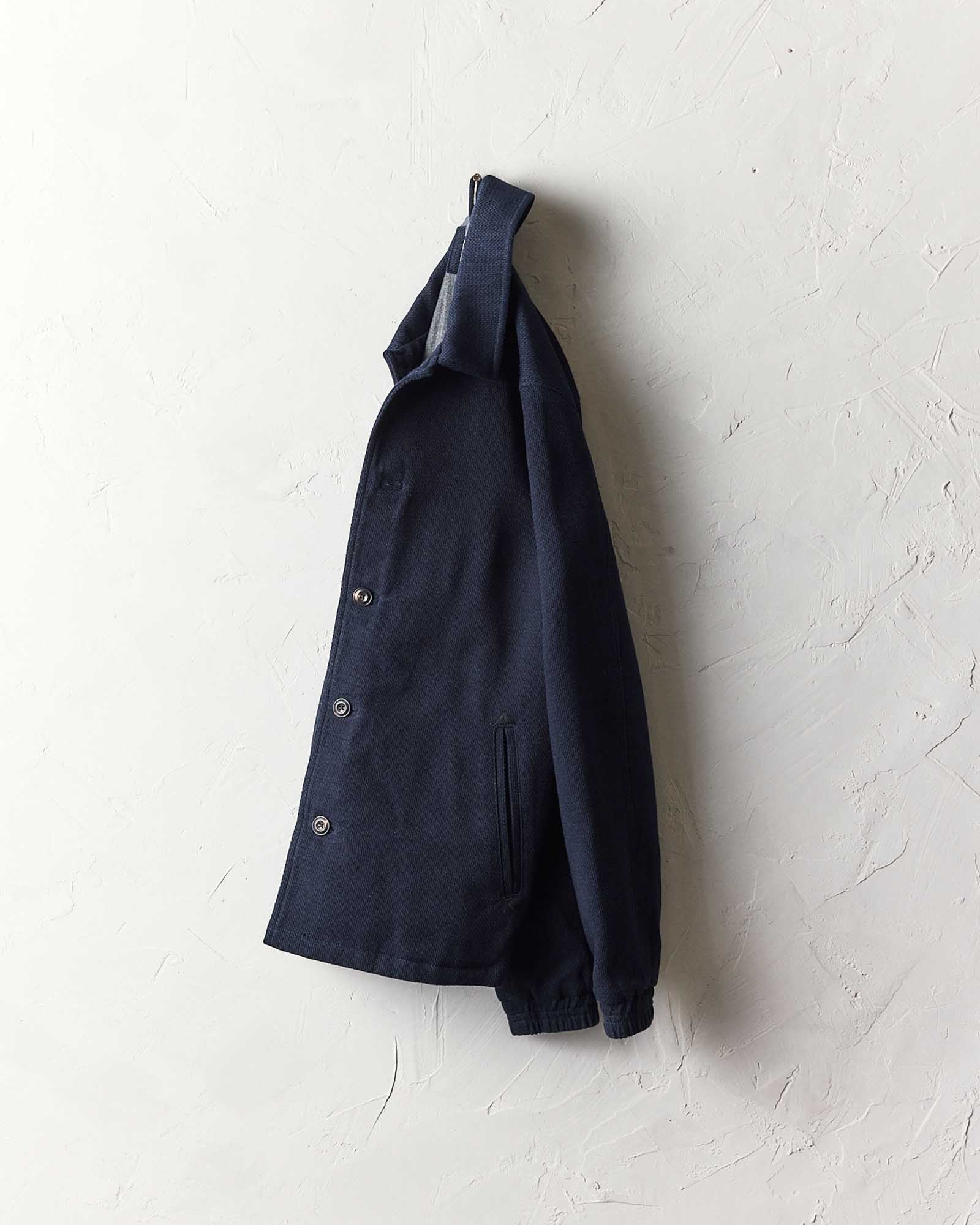 editorial image of The Crew Jacket in Raw Indigo Sashiko hanging, Outerwear by Taylor Stitch