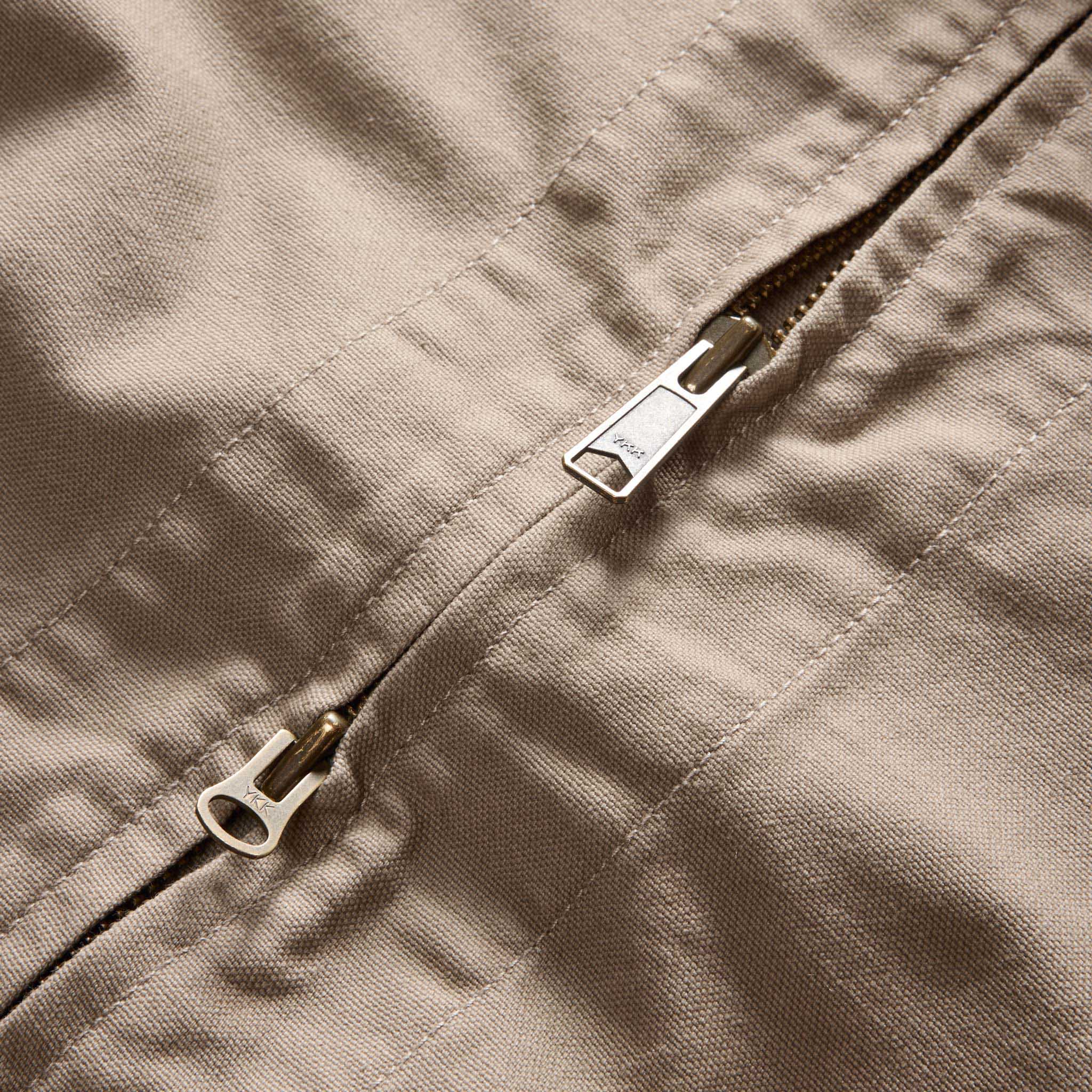 material shot of the two way zipper on The Shifter Jacket in Baked Soil Canvas, Outerwear by Taylor Stitch