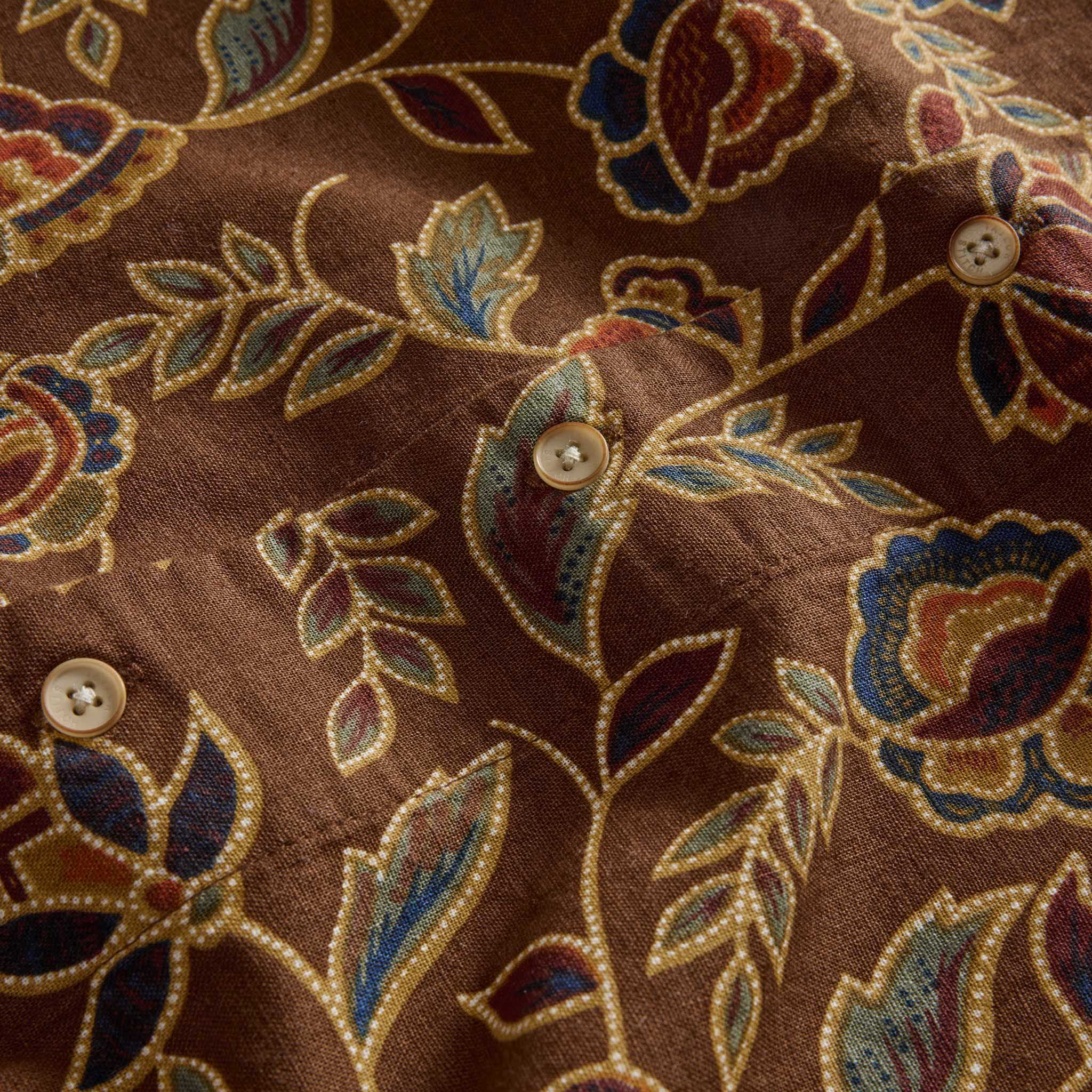 material shot of the buttons on The Short Sleeve Davis Shirt in Burnt Toffee Print, Wovens by Taylor Stitch