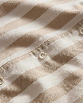 material shot of the buttons on The Short Sleeve Davis Shirt in Sandbar Stripe, Wovens by Taylor Stitch