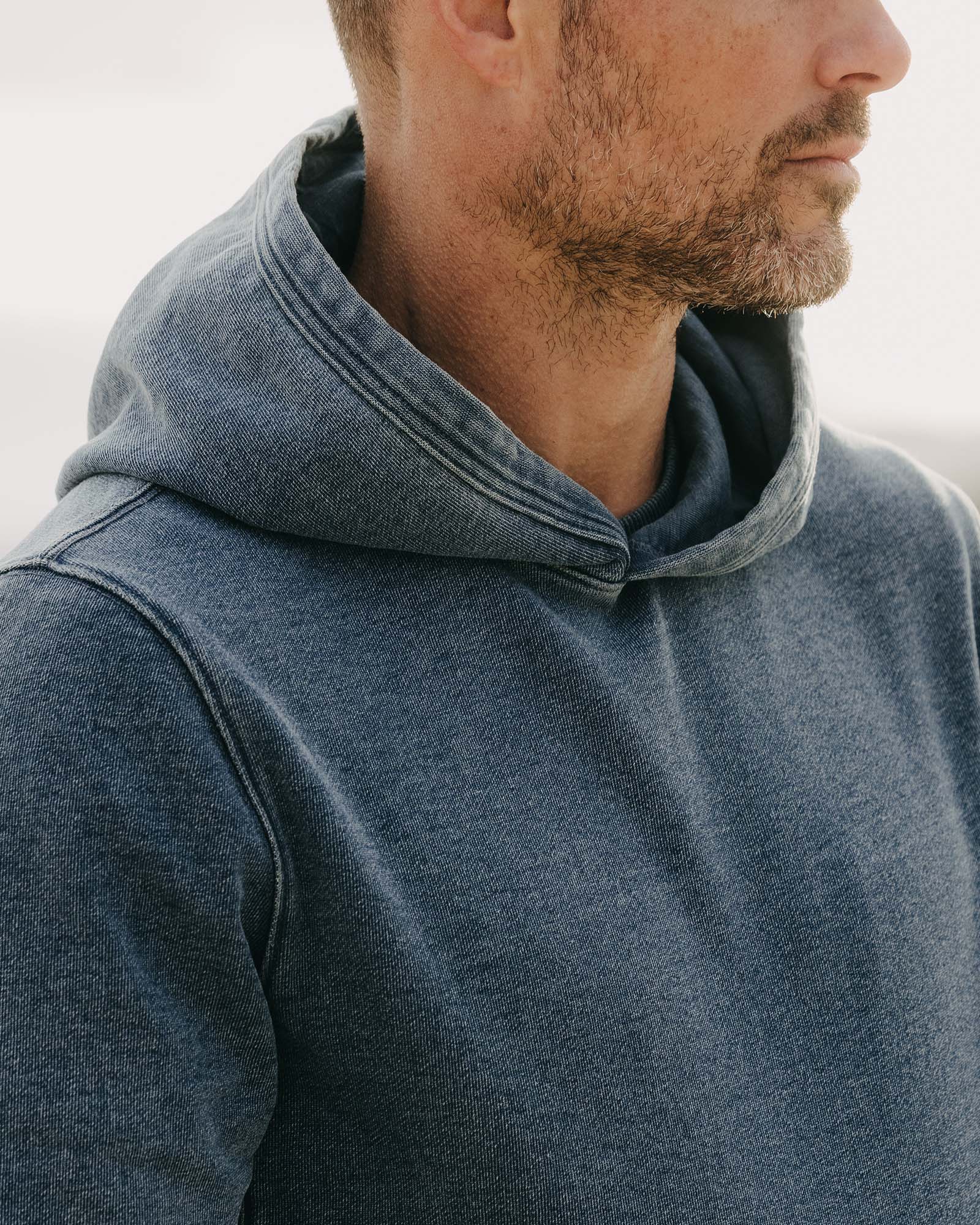 fit model showing off the hoodie on The Apres Hoodie in Washed Indigo Terry, Knits by Taylor Stitch