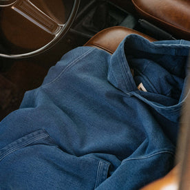 editorial image of The Apres Hoodie in Washed Indigo Terry in a car