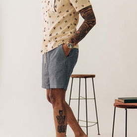 fit model walking wearing The Apres Short in Indigo Chambray