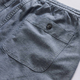 material shot of the back pocket on The Apres Short in Indigo Chambray