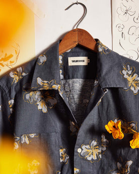 editorial image of The Conrad Shirt in Dark Blue Floral on a hanger, Wovens by Taylor Stitch