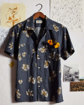 editorial image of The Conrad Shirt in Dark Blue Floral in front of drawings, Wovens by Taylor Stitch