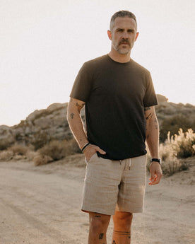 fit model with his hand in his pocket wearing The Cotton Hemp Tee in Charcoal, Knits by Taylor Stitch