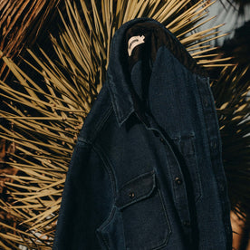 editorial image of The Division Shirt in Indigo Twill on a plant