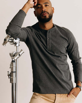 fit model posing wearing The Heavy Bag Henley in Heather Grey, Knits by Taylor Stitch