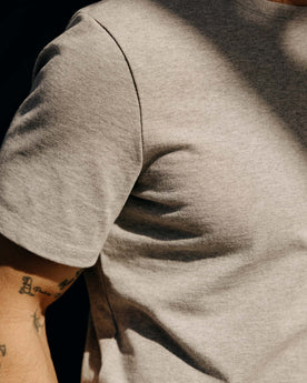 fit model showing off the sleeves on The Heavy Bag Tee in Aluminum, Knits by Taylor Stitch