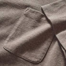 material shot of the pocket on The Heavy Bag Tee In Smoked Olive