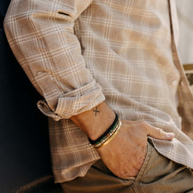 fit model with his hand in his pocket wearing The Jack in Heather Flax Plaid
