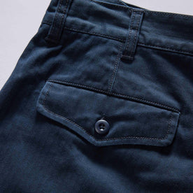 material shot of the back pocket on The Matlow Short in Dark Navy Herringbone