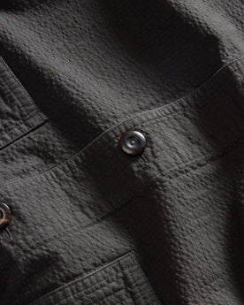 material shot of the buttons on The Ojai Jacket in Faded Black Seersucker, Outerwear by Taylor Stitch