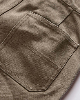 material shot of the back pockets on The Camp Short in Stone Chipped Canvas, Bottoms by Taylor Stitch