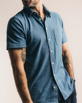 fit model sitting wearing The Short Sleeve California in Washed Indigo Slub, Wovens by Taylor Stitch