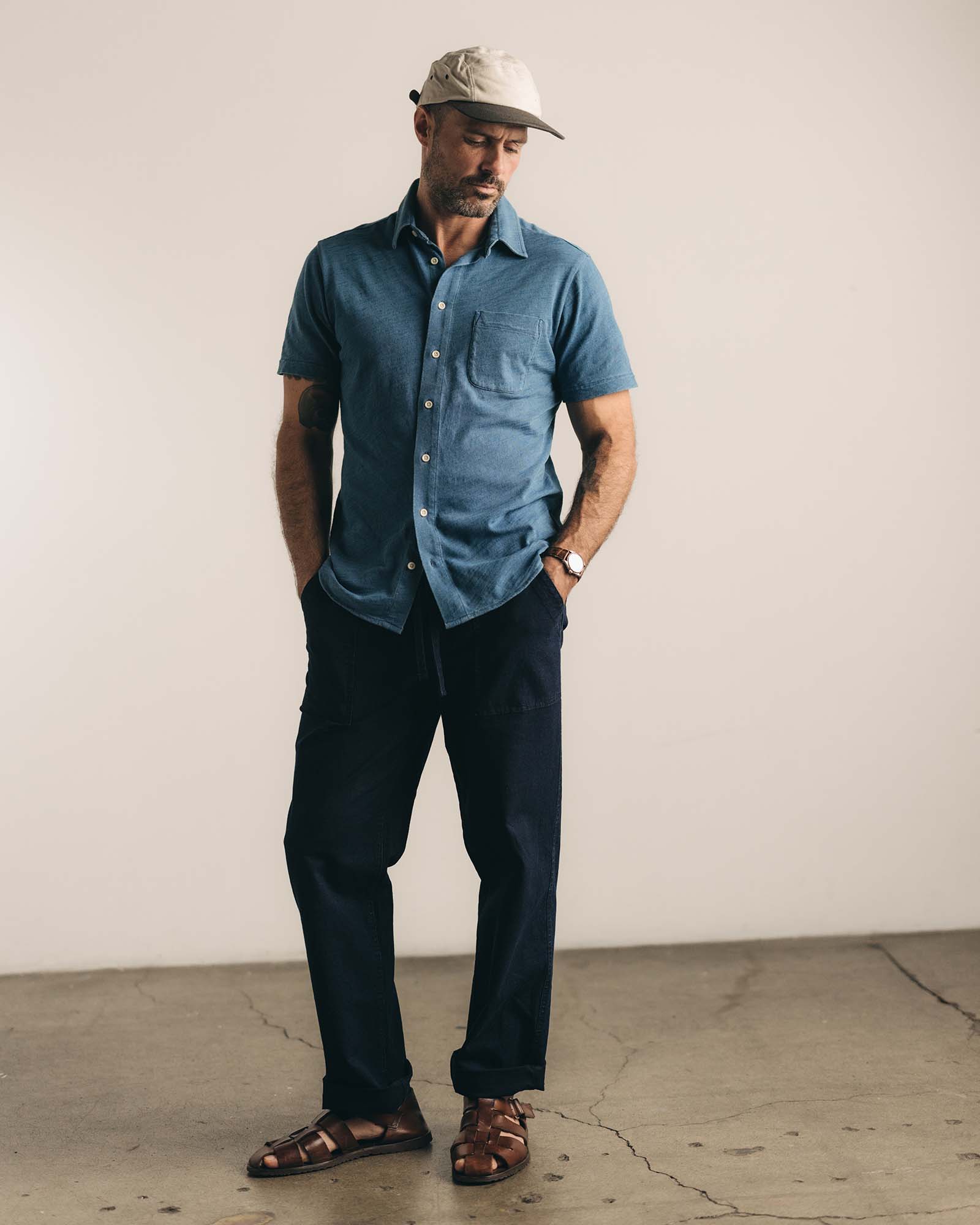 fit model standing in The Short Sleeve California in Washed Indigo Slub, Wovens by Taylor Stitch