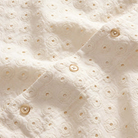 material shot of the buttons on The Short Sleeve Hawthorne in Vintage White Embroidered Eyelet