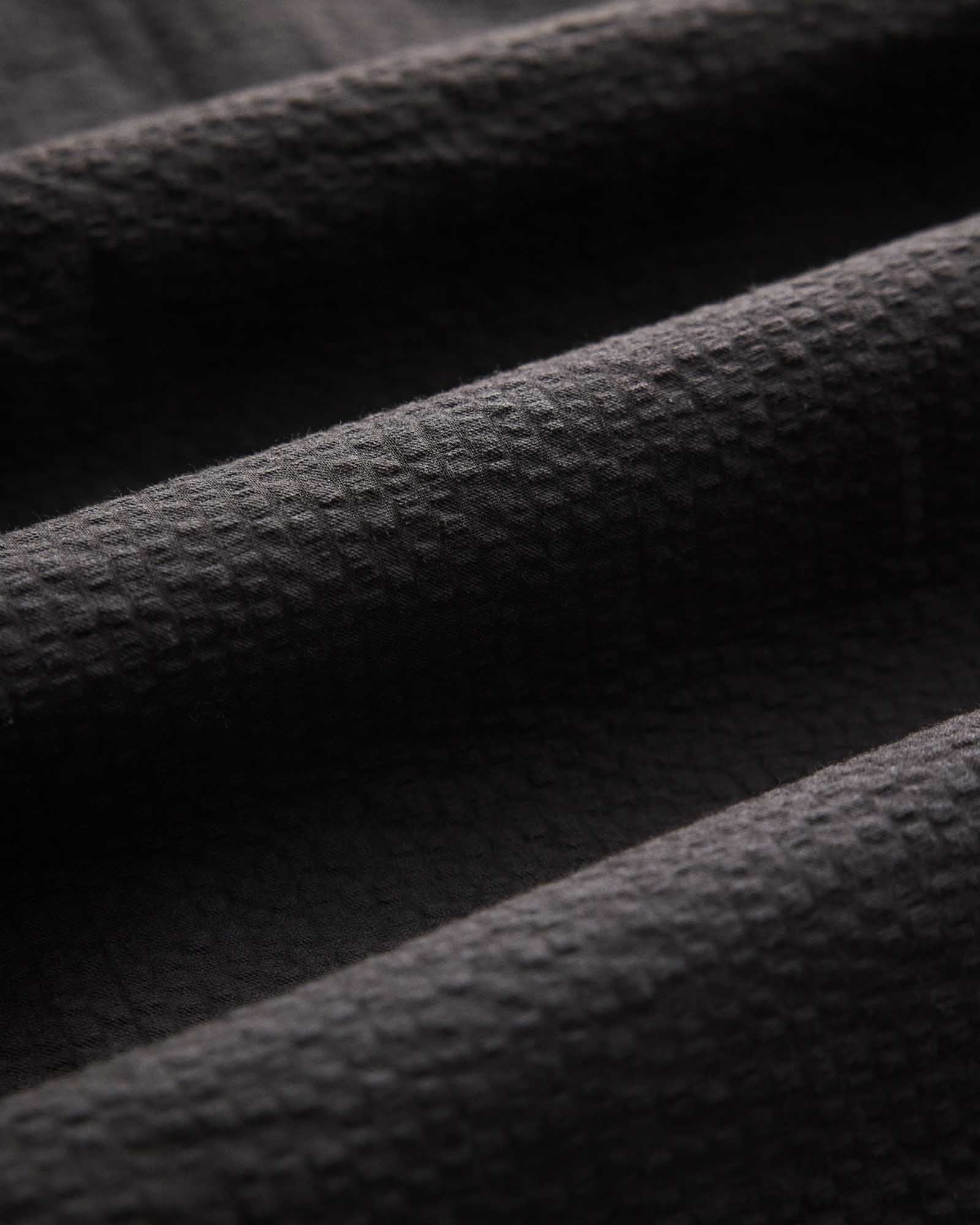 material shot of the collar on The Short Sleeve Jack in Faded Black Seersucker, Wovens by Taylor Stitch