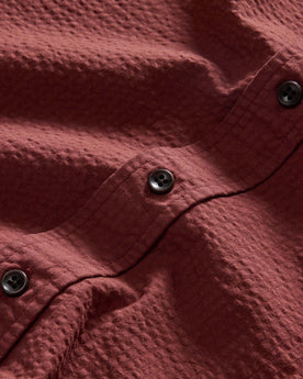 material shot of the buttons on The Short Sleeve Jack in Dried Cherry Seersucker, Wovens by Taylor Stitch