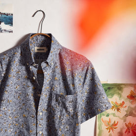 editorial image of The Short Sleeve Jack in Light Blue Floral on a hanger