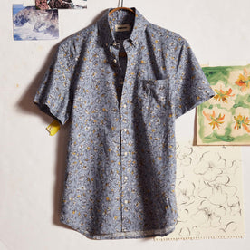 editorial image of The Short Sleeve Jack in Light Blue Floral in front of drawings