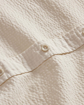 material shot of the buttons on The Short Sleeve Jack in Natural Seersucker, Wovens by Taylor Stitch