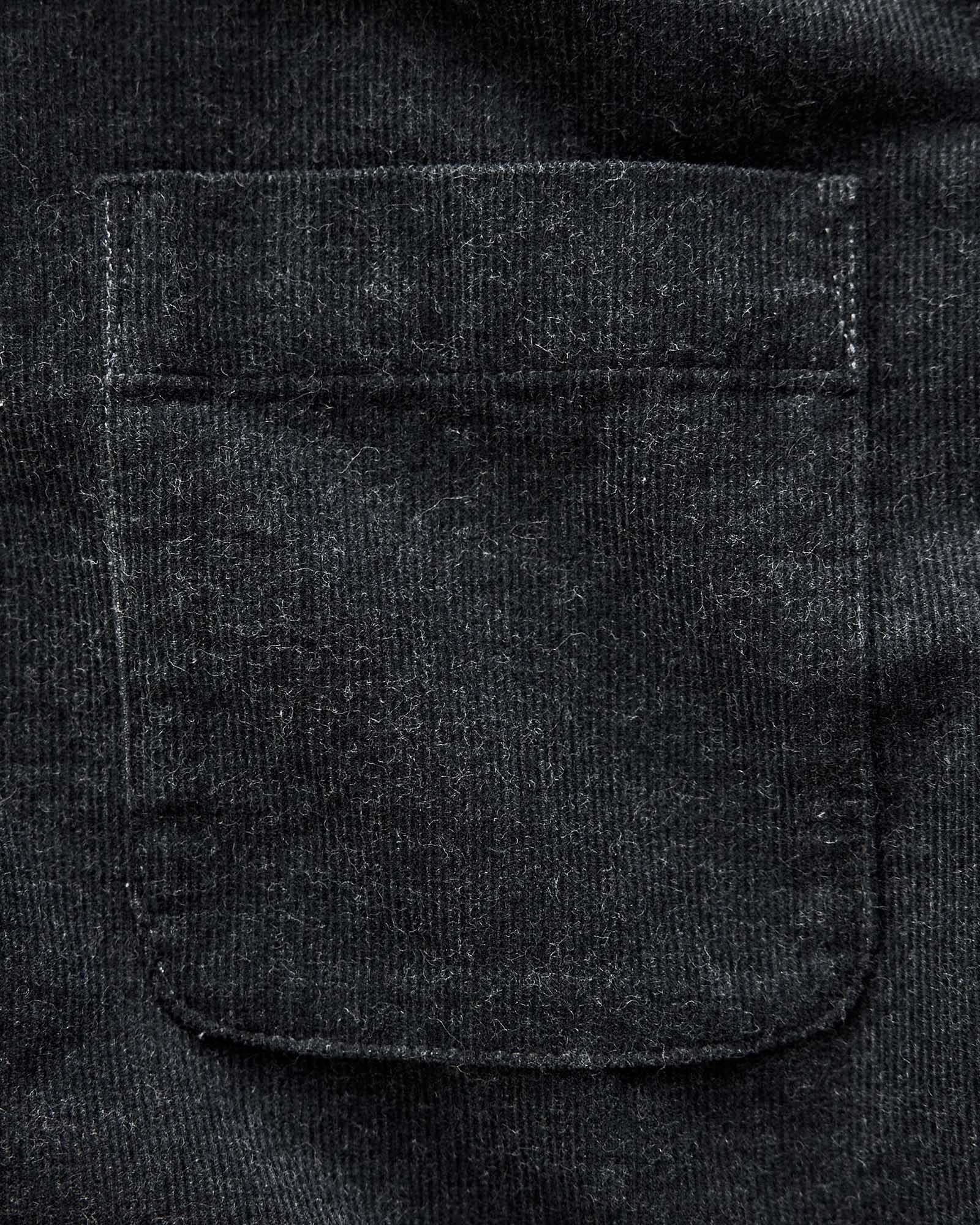 material shot of the pocket on The Short Sleeve California in Heather Coal Cord, Wovens by Taylor Stitch