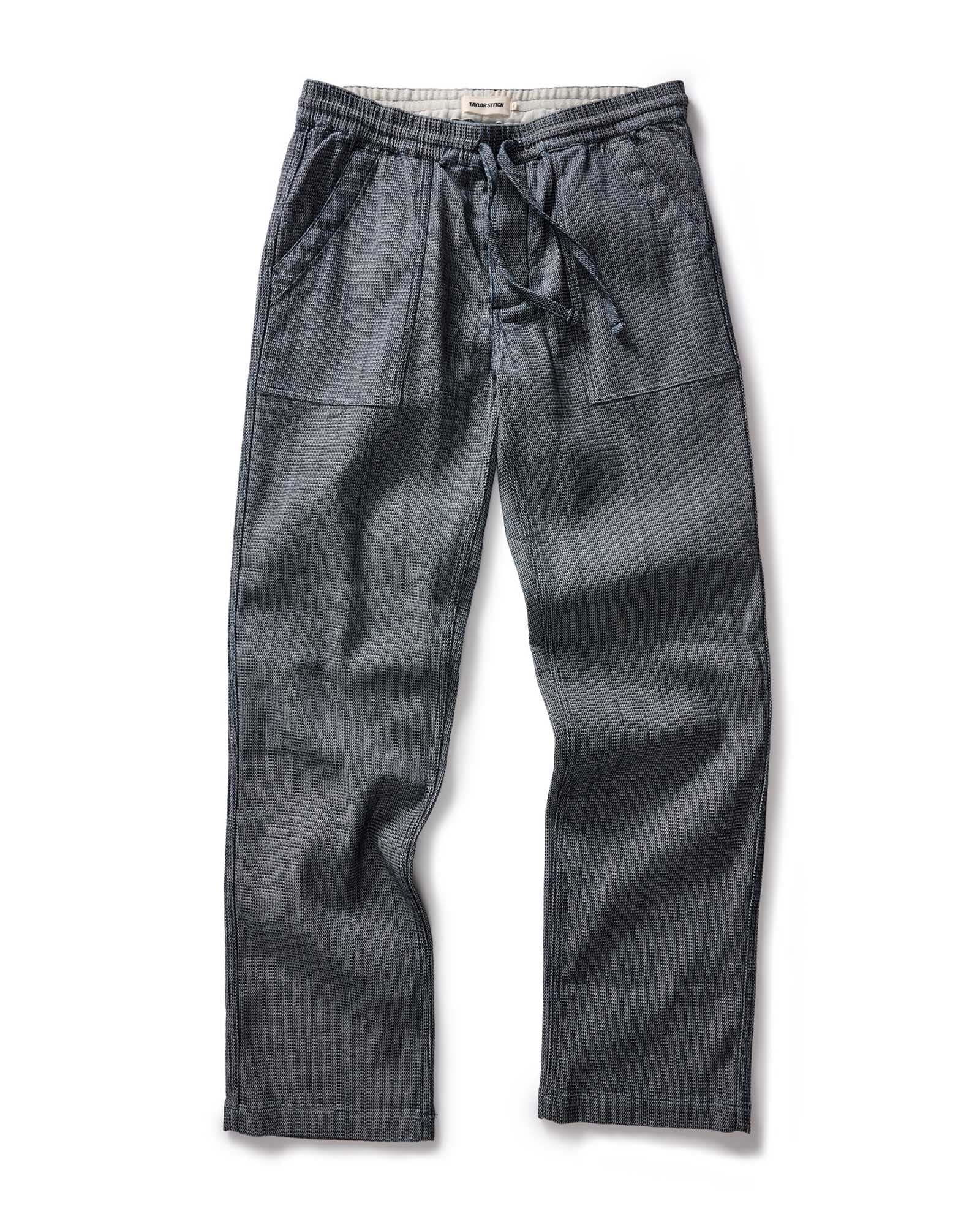 flatlay of The Breakwater Pant in Rinsed Indigo Stripe, Bottoms by Taylor Stitch