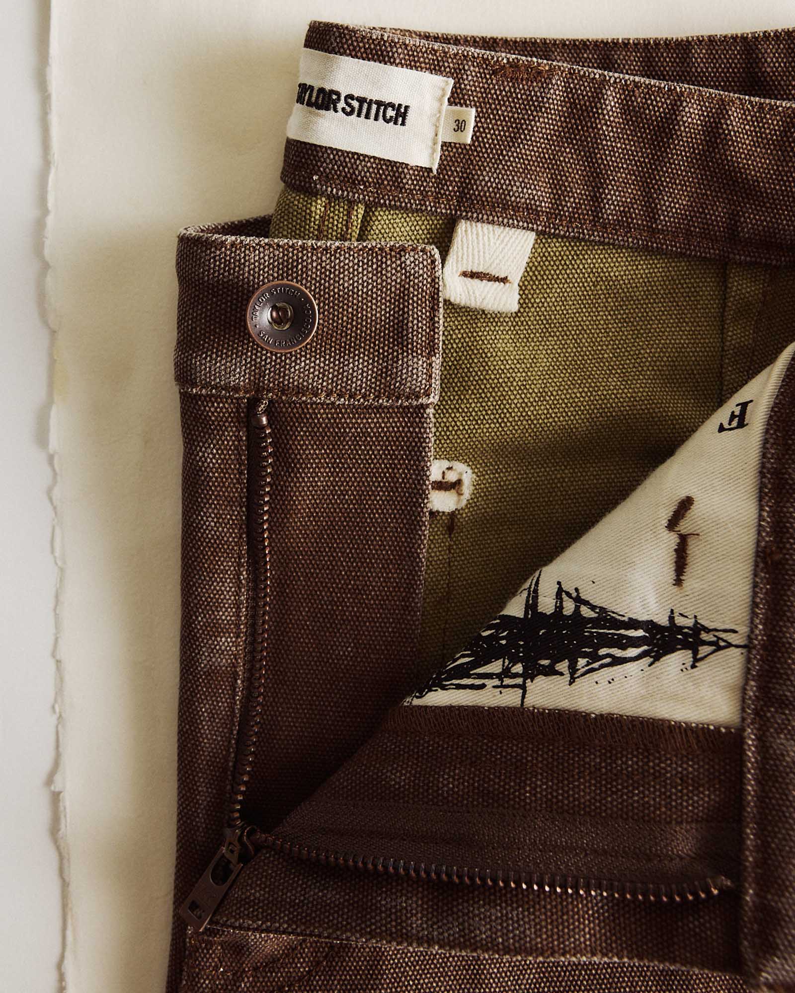 material shot of the button on The Camp Short in Aged Penny Chipped Canvas, Bottoms by Taylor Stitch