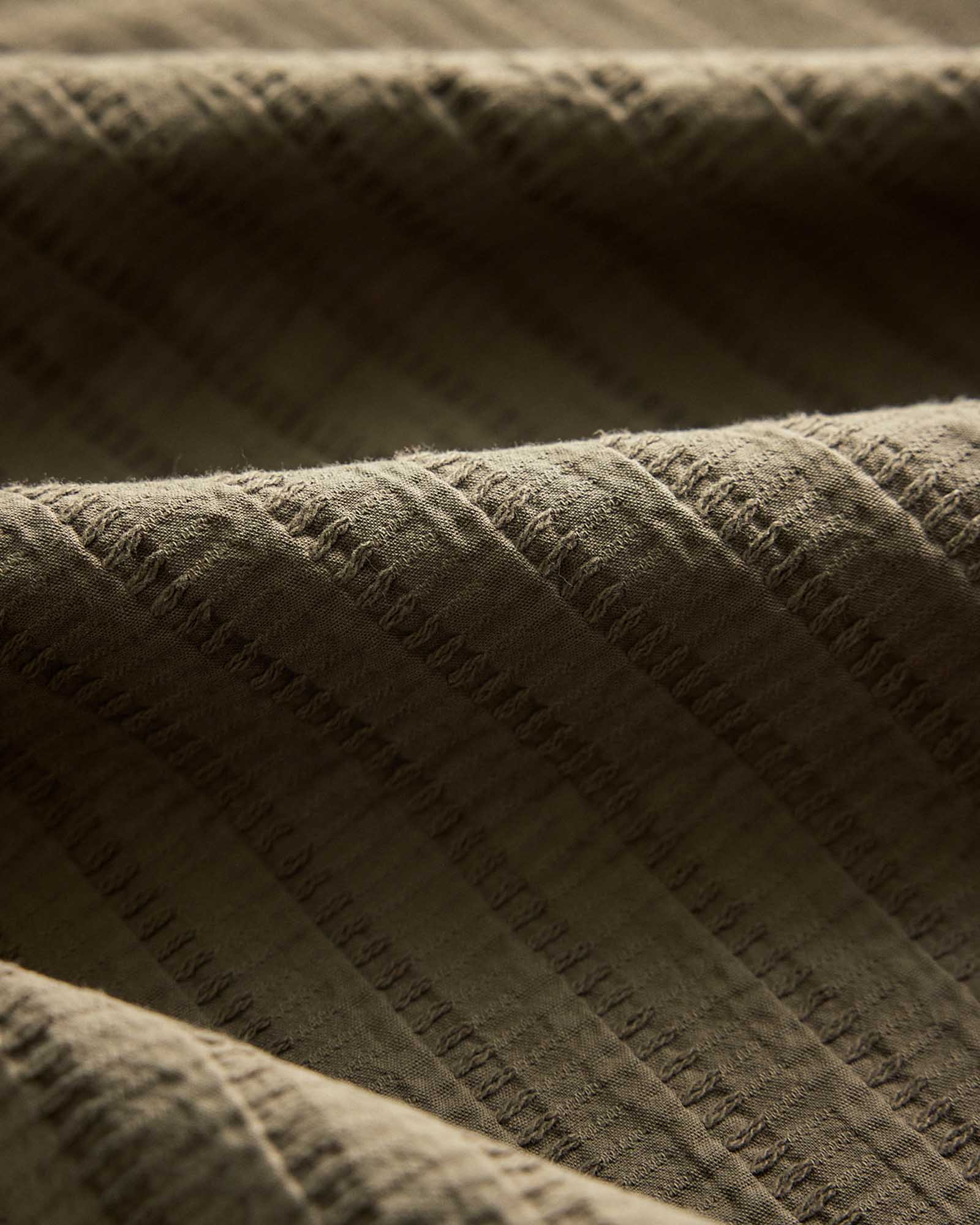 material shot of the fabric on The Conrad Shirt in Fatigue Olive Dobby Stripe, Wovens by Taylor Stitch