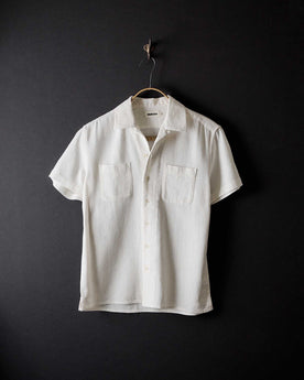 editorial image of The Conrad Shirt in Vintage White Linen hanging, Wovens by Taylor Stitch