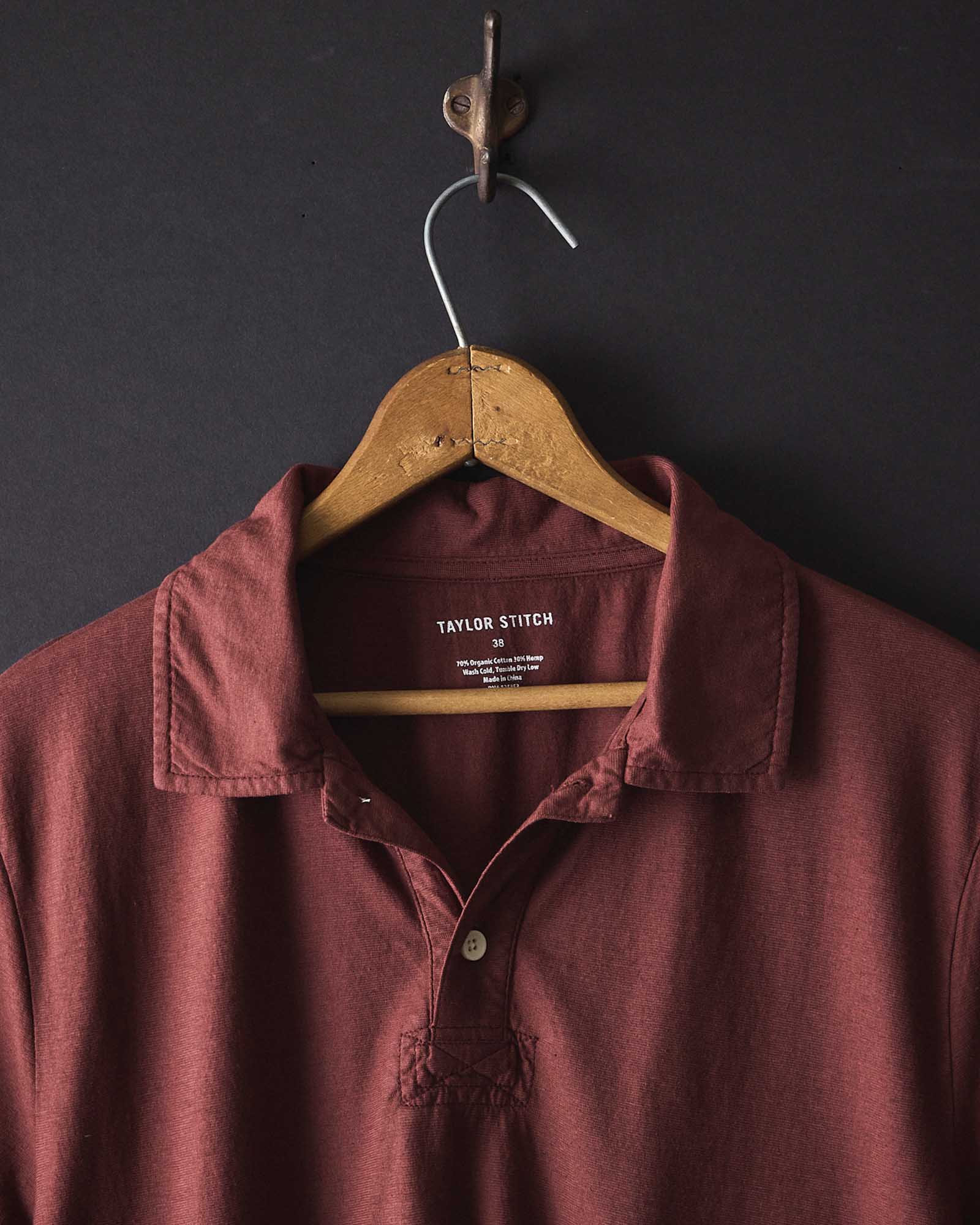 editorial image of The Cotton Hemp Polo in Black Cherry hanging, Knits by Taylor Stitch