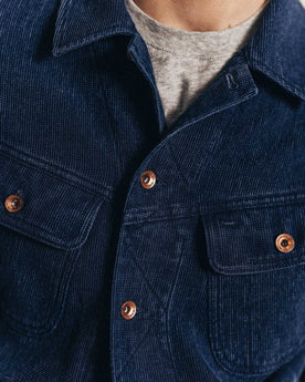 close up of the front pockets and antique copper buttons on The Long Haul Jacket in Rinsed Indigo Waffle, Outerwear by Taylor Stitch