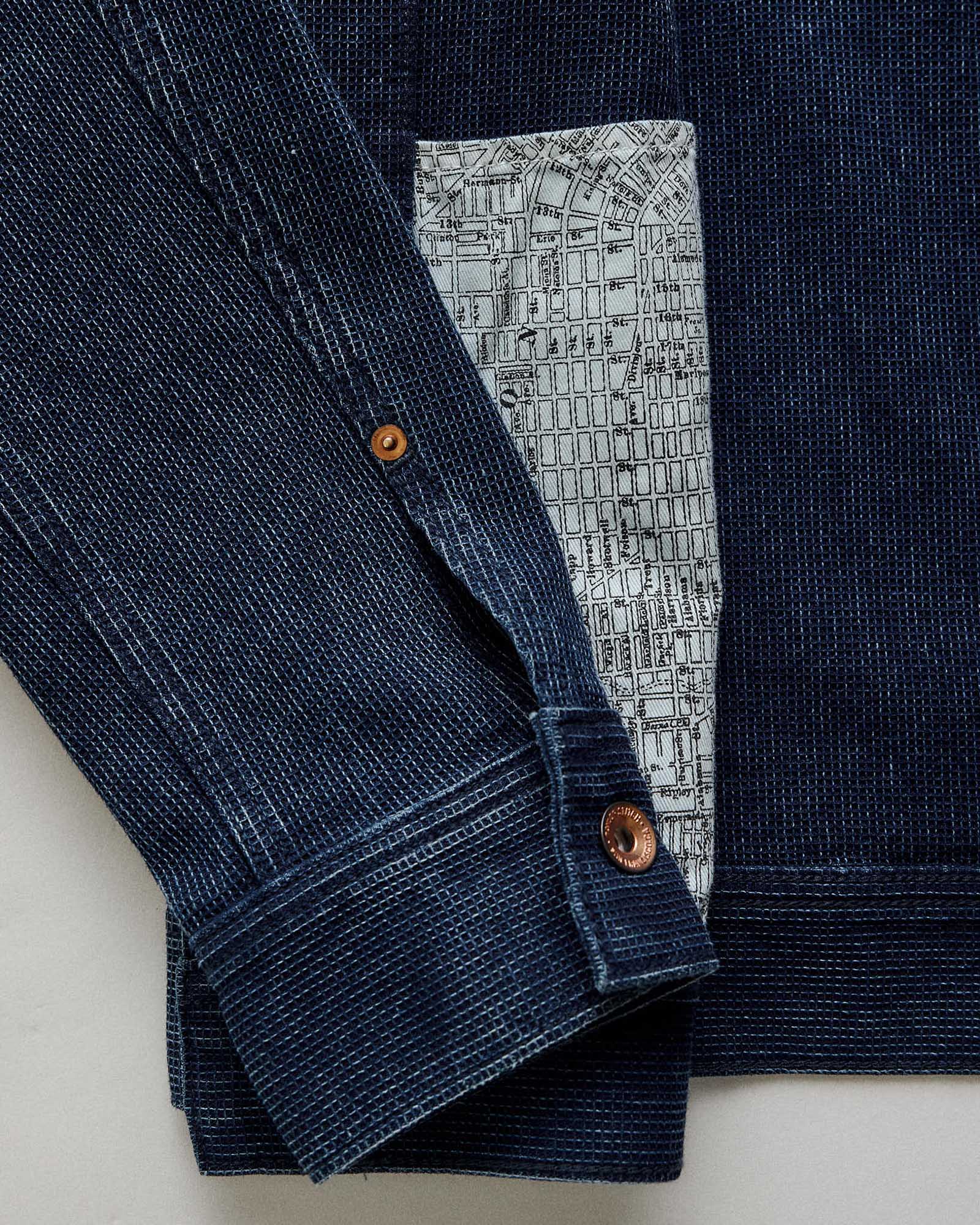 Close up of the sleeves on The Long Haul Jacket in Rinsed Indigo Waffle, Outerwear by Taylor Stitch