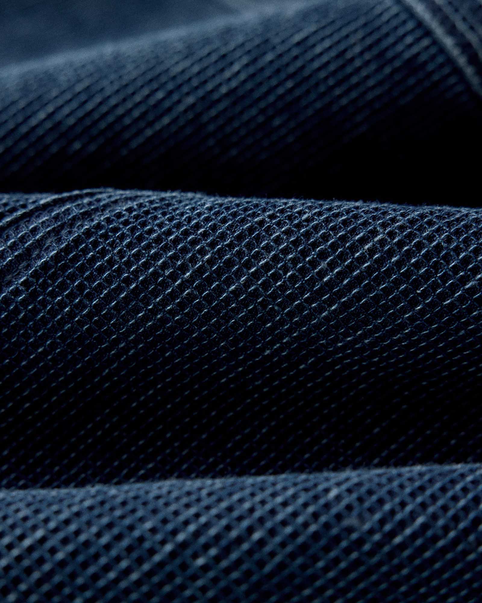 Close up of the waffle fabric on The Long Haul Jacket in Rinsed Indigo Waffle, Outerwear by Taylor Stitch