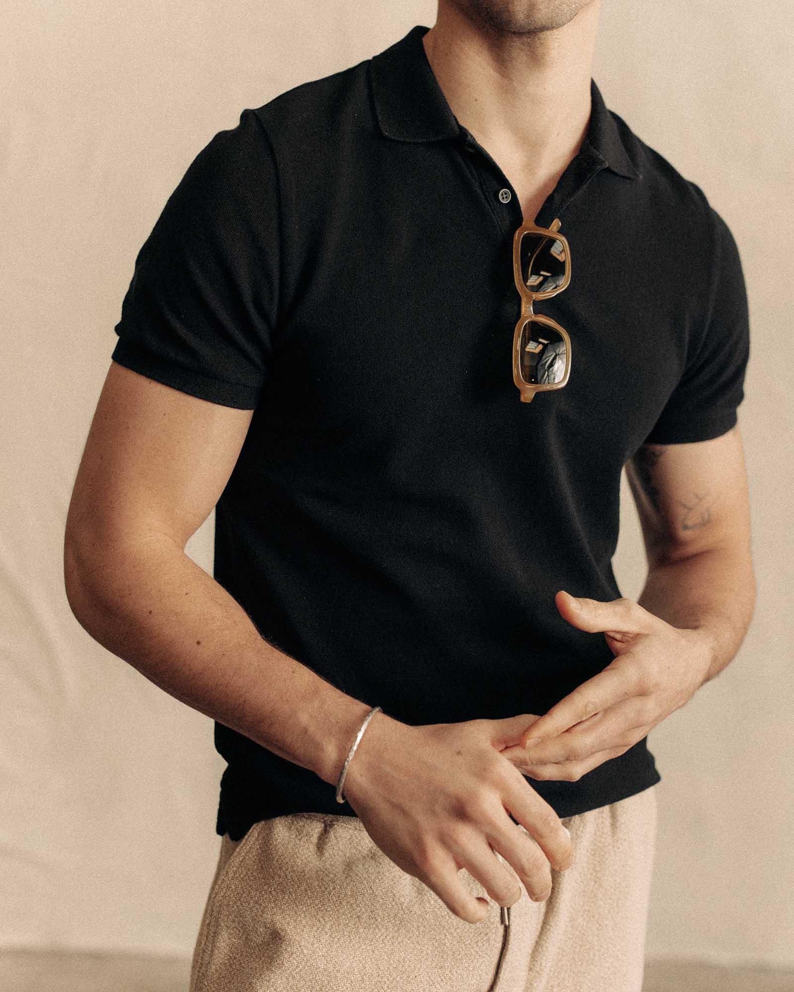 fit model wearing The Pacific Polo in Black Indigo Pique, Knits by Taylor Stitch