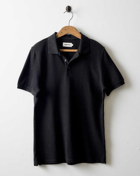 editorial image of The Pacific Polo in Black Indigo Pique hanging, Knits by Taylor Stitch