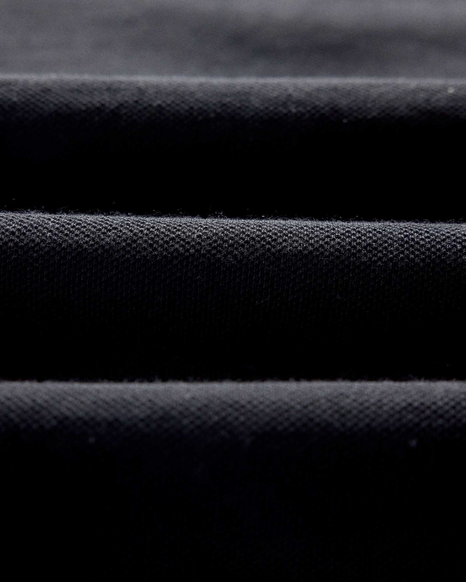 material shot of the fabric on The Pacific Polo in Black Indigo Pique, Knits by Taylor Stitch