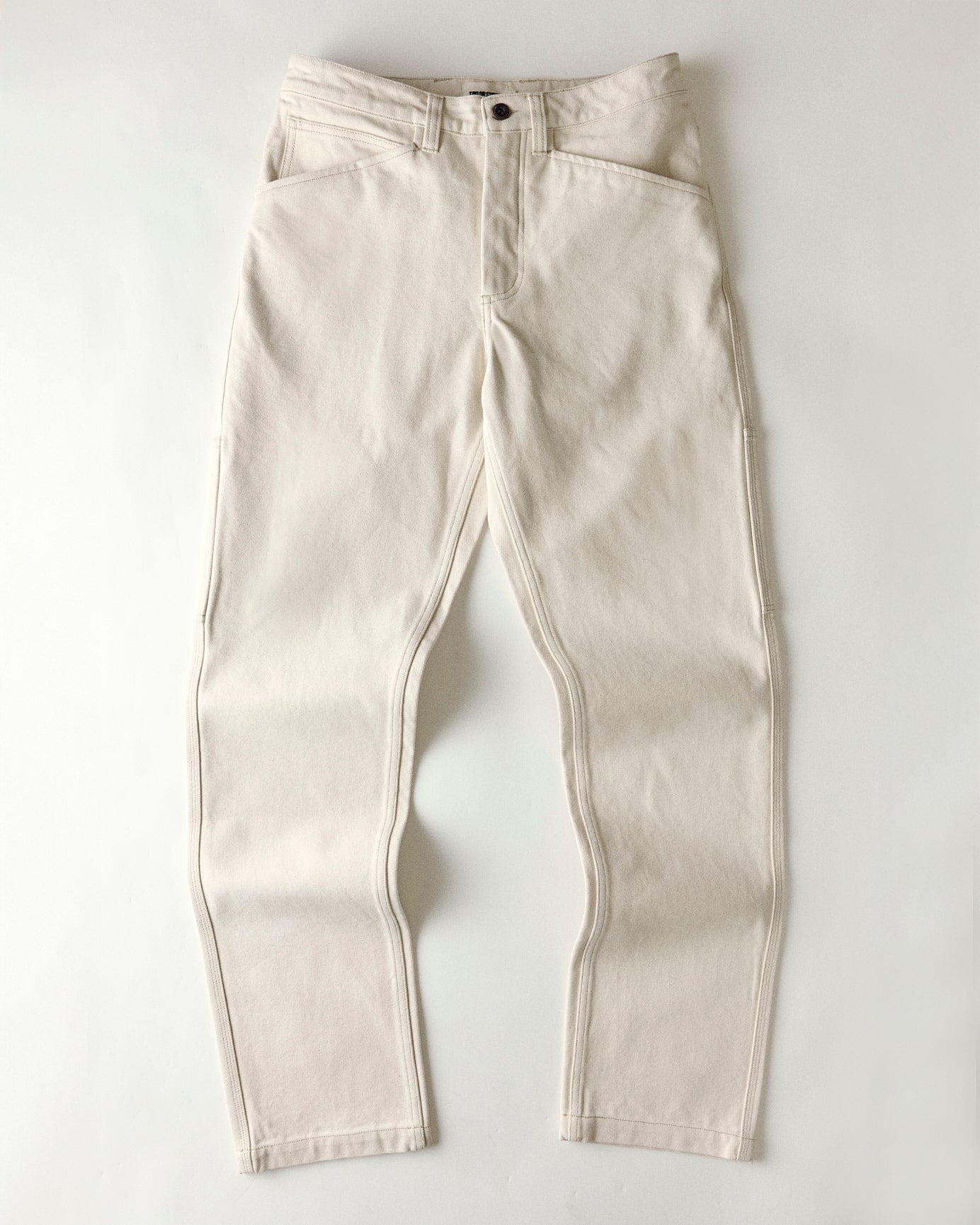 flatlay of The Painter Pant in Seeded Natural Chipped Canvas, Bottoms by Taylor Stitch