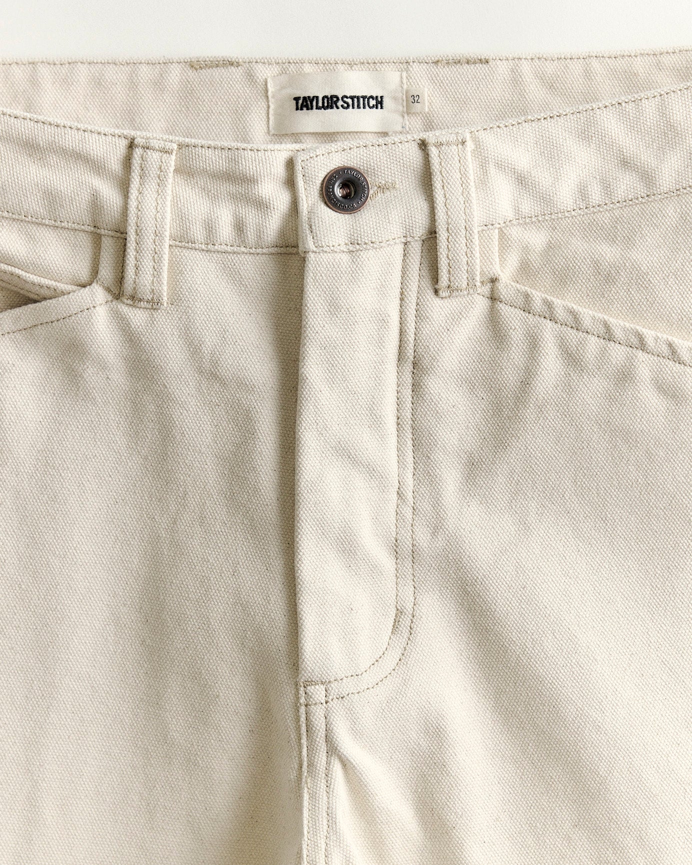 material shot of the waistband on The Painter Pant in Seeded Natural Chipped Canvas, Bottoms by Taylor Stitch