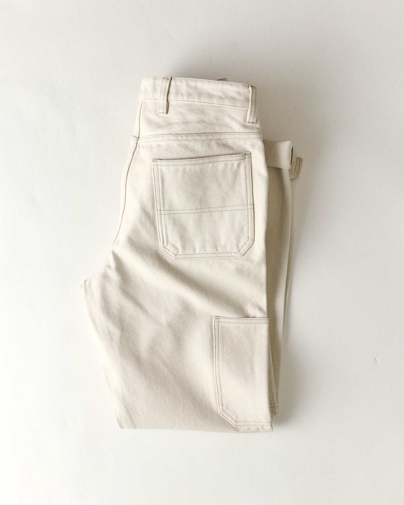 material shot of the back pocket on The Painter Pant in Seeded Natural Chipped Canvas, Bottoms by Taylor Stitch