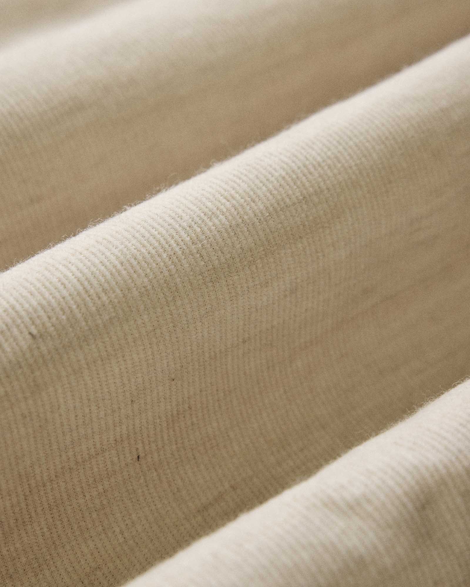 material shot of the fabric on The Short Sleeve California in Heather Oat Cord, Wovens by Taylor Stitch