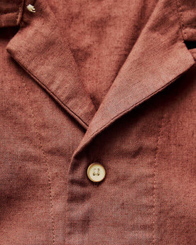 material shot of the button on The Hawthorne Shirt in Red Wine Border Eyelet, Wovens by Taylor Stitch