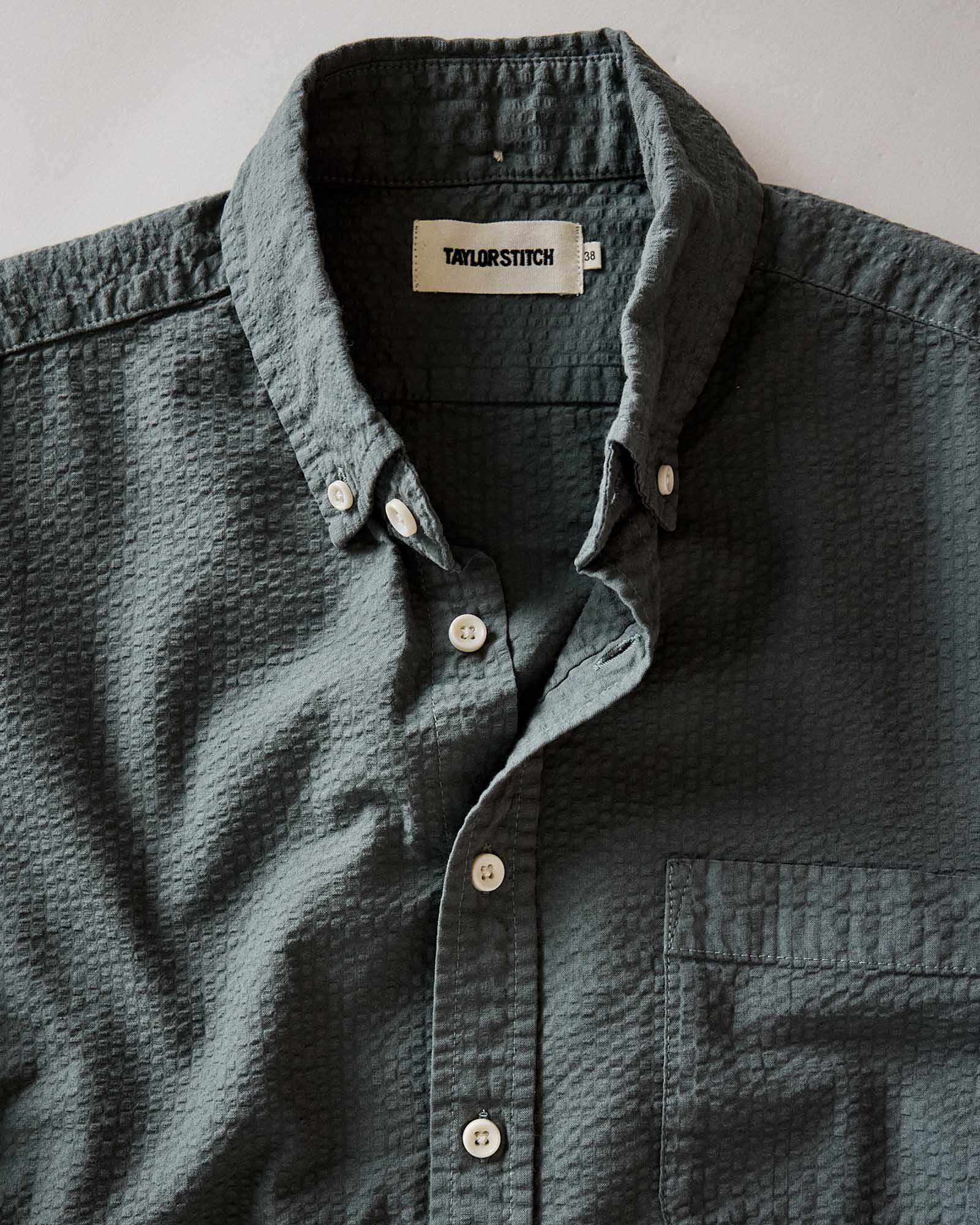 material shot of the collar on The Short Sleeve Jack in Deep Sea Seersucker, Wovens by Taylor Stitch