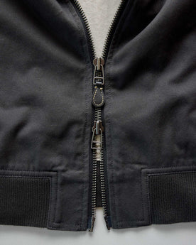 material shot of the zipper on The Speedway Bomber in Organic Faded Black Twill, Outerwear by Taylor Stitch