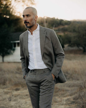 fit model posing in The Stevens Sportcoat in Coffee Linen Herringbone, Outerwear by Taylor Stitch