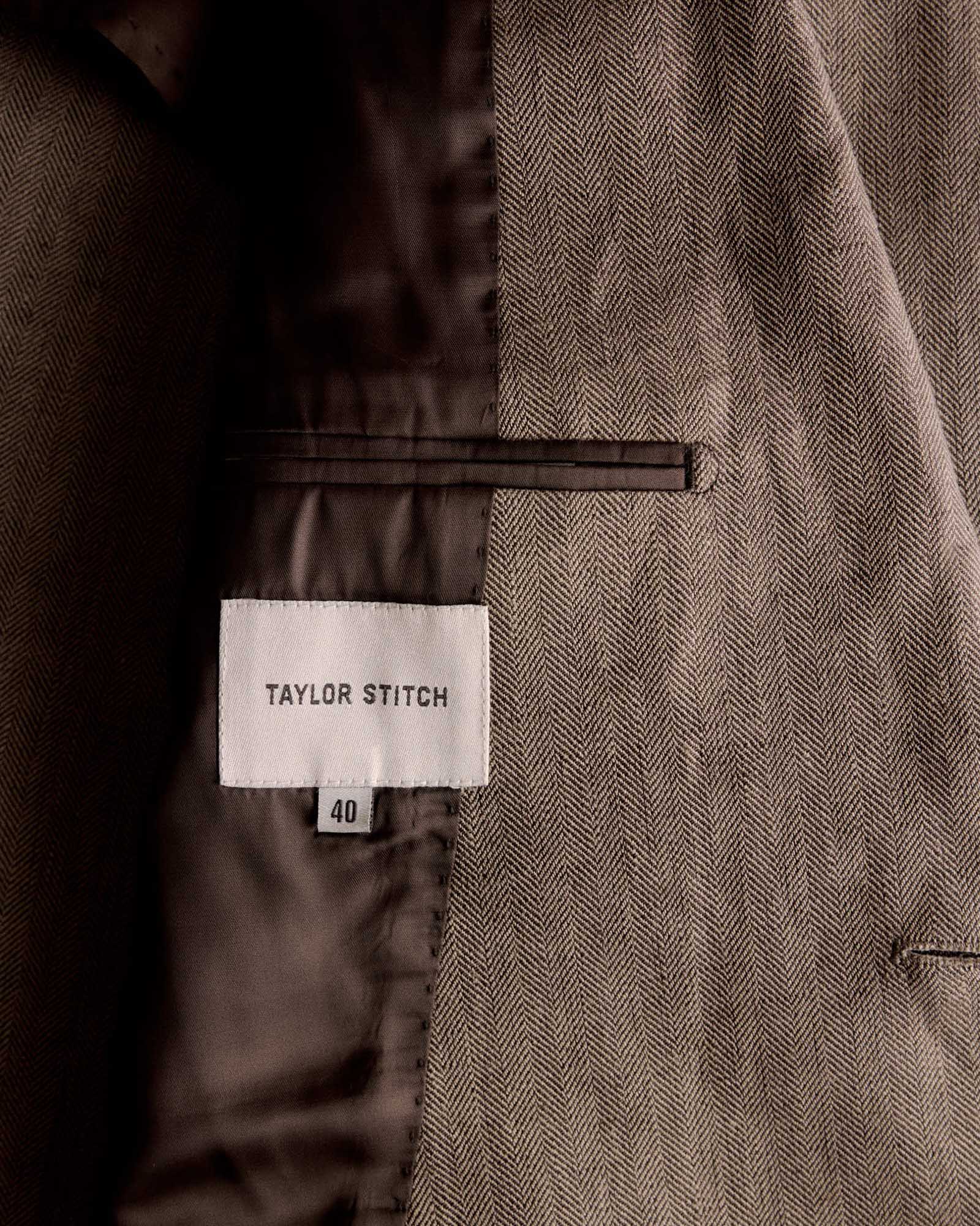 material shot of the tag on The Stevens Sportcoat in Coffee Linen Herringbone, Outerwear by Taylor Stitch